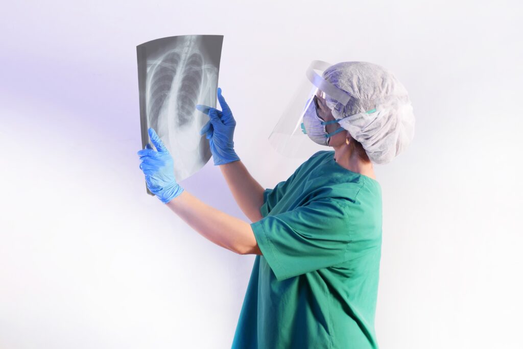 Doctor surgeon in overalls uniform examines an x-ray of the lungs